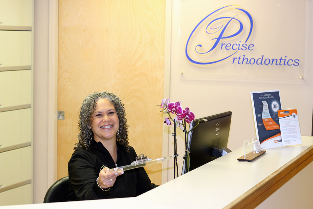 A woman sitting in the reception area