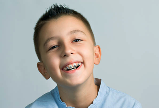 Happy teen boy with braces smiling