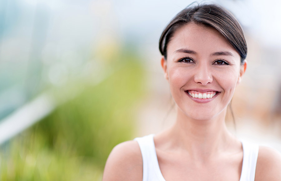 Happy woman smiling headshot on the display